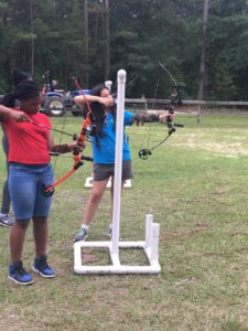 Girls shooting bows