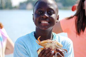 Boy holding crab